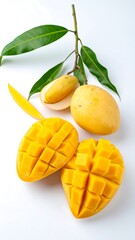 Ripe yellow mangoes, cut and whole