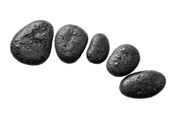 Smooth basalt stones with natural wet speckles, size-graduated in curved alignment, isolated on transparent background.
