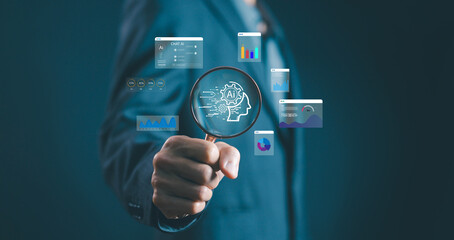 Businessman holding a magnifying glass with AI technology icons and data analytics charts,...