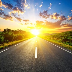 Asphalt road stretching into sunset