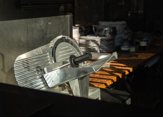 Vintage meat slicer in a kitchen setting