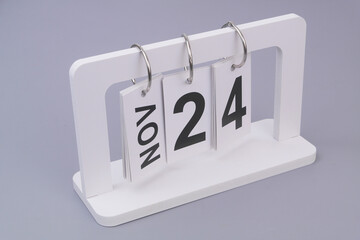 November, 24 on calendar on grey background.	