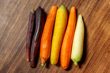 fresh carrots on wooden table