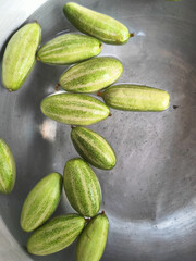 Fresh Green Pointed Gourds in Water