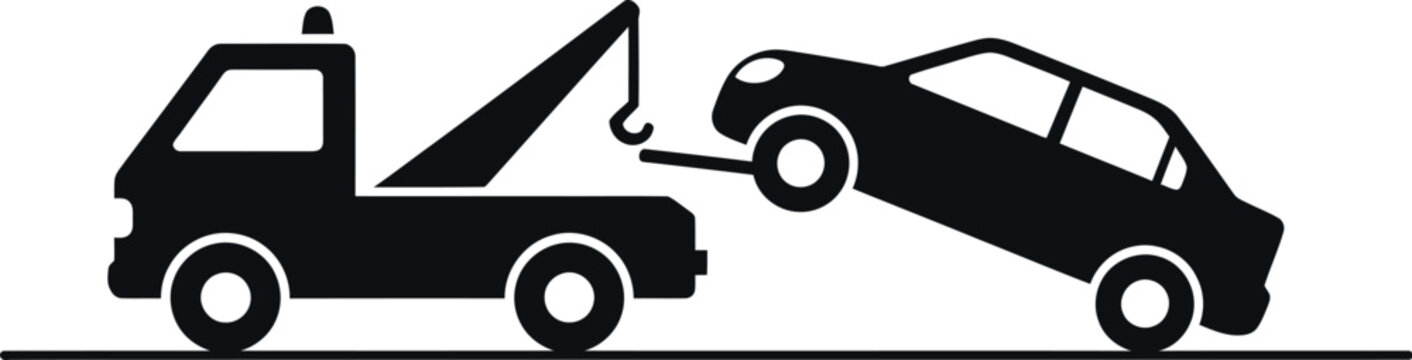 Tow truck lifting a car for transport, illustrating roadside assistance or vehicle recovery.