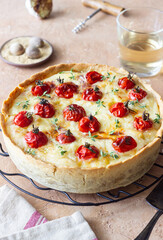 Quiche with cheese, tomatoes, and thyme. Pie. Pastries. Vegetarian food.