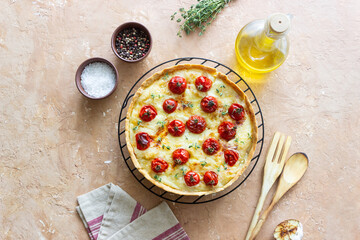 Quiche with cheese, tomatoes, and thyme. Pie. Pastries. Vegetarian food.