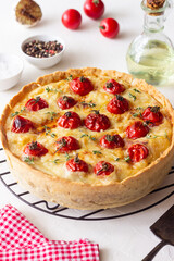 Quiche with cheese, tomatoes, and thyme. Pie. Pastries. Vegetarian food.