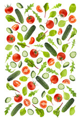 Set of fresh vegetables, leafy greens as ingredients for salad, art pattern, isolated. Cucumbers sliced, cherry tomato, lush green spinach, arugula leaves. Ideal for organic cuisine, healthy eating.