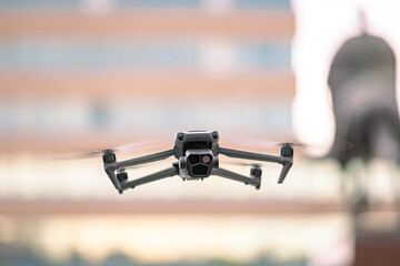 Professional drone with camera is hovering