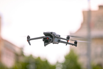 Professional drone with camera is hovering