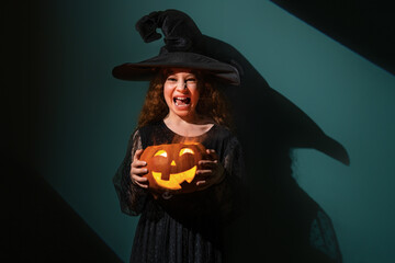 girl with Halloween pumpkin
