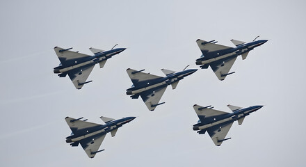 Five Chengdu J-10 Vigorous Dragon fighter jets of the August 1st aerobatic team flying in a V-formation.