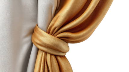 Golden drapery tied in a knot against a backdrop of off-white