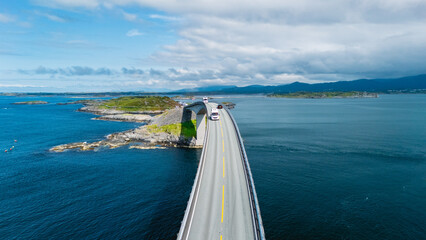 Stunning aerial view of the Atlantic Ocean Road in Norway, showcasing its unique architecture as it...