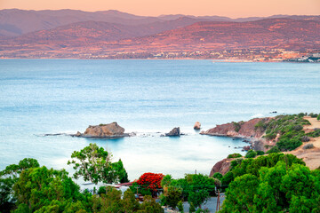 Fototapeta premium Mediterranean landscape coast island Cyprus with turquoise sea in bay at sunset seen from above, Aphrodite mountain trail on Akamas peninsula, Latchi.
