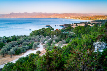 Fototapeta premium View from above on Mediterranean coastline Cyprus island with turquoise water at sunset, Aphrodite trail, Akamas peninsula, Latchi.