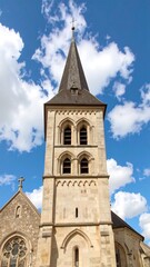 Obraz premium Church tower against a partly cloudy sky