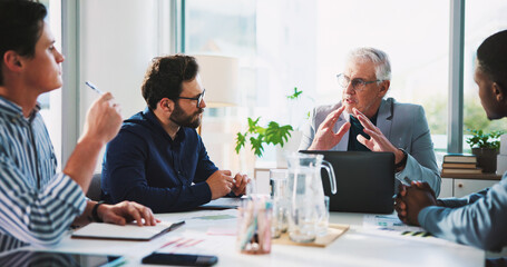 Conversation, laptop and meeting with business people at table together for coaching or training. Boardroom. computer and management with mentor teaching employee team in workplace for development