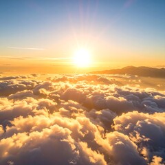 Golden sunrise above clouds