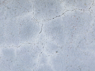 White cracked concrete wall texture with weathered surface detail