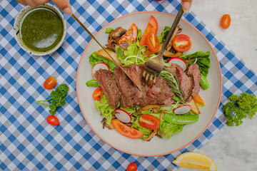 Fresh Steak Salad: A culinary creation, with a fresh steak salad, a medley of vibrant greens, juicy tomatoes, and a savory dressing, ready to delight the senses.