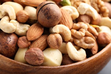Mix of different nuts in bowl, closeup