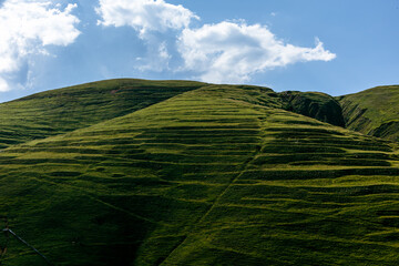 green mountain with blue sky