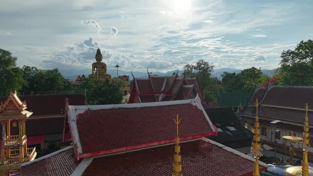 A large chedi temple surrounded by smaller golden chedis