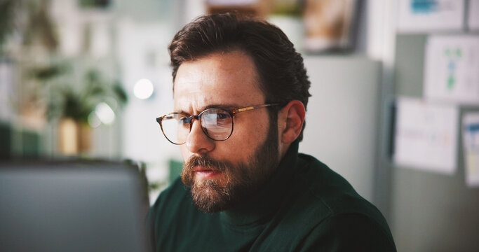 Planning, computer and reading with business man in office for seo research, blog traffic and review. Search volume report, webiste and engagement ranking with person in media agency for kpi insight