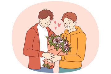 Gay man gives flowers to boyfriend during date and feels safe thanks to society tolerance for LGBT people. Gay guy receives bouquet from lover, on anniversary of relationship or on valentine day