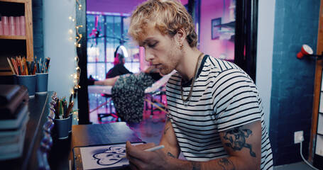 Tablet, tattoo artist and drawing with man in studio for artwork design preview, aesthetic and body...