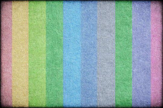 A textured, multicolored, vertical striped background