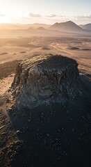 Aerial View: Volcanic Rock Formation at Sunset, Desert Landscape
