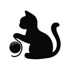 Silhouette of a cat playing with a ball of yarn playfully