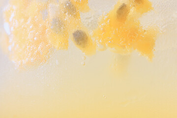 passion fruit lemonade background, cold lemonade in a glass, delicate texture cold tropical drink background