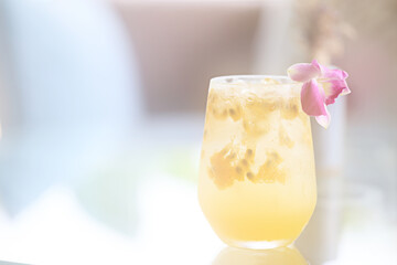 passion fruit lemonade background, cold lemonade in a glass, delicate texture cold tropical drink background