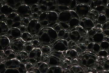 texture bubbles on a black background, soap bubbles, abstract circles, shape abstraction in full screen