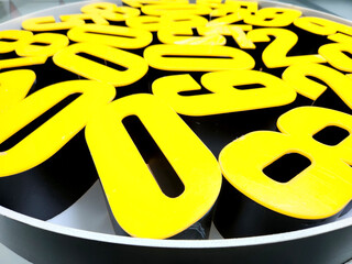yellow and white plexiglass box letters
