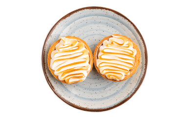 French lemon tart with meringue isolated on white, top view, flat lay, close up
