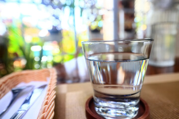 a glass of cold water on the table in the restaurant