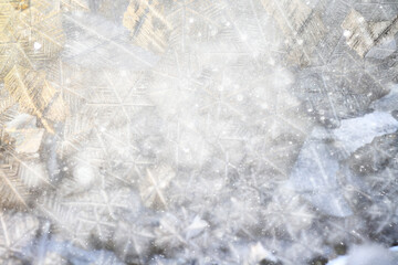 white winter background, frosty patterns on glass, abstract backdrop of ice and snow crystals in a...