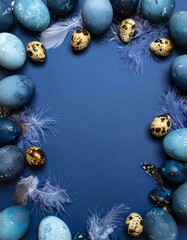 Blue eggs and feathers in a frame
