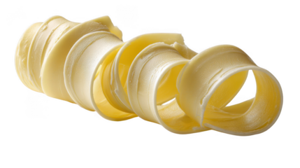 Close up of a butter curl on a black background showing the texture and shape of the dairy product