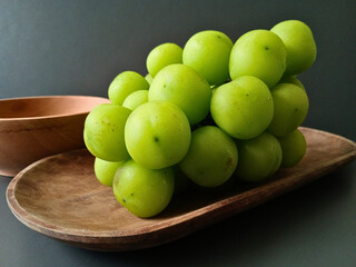 fresh green grapes on table 