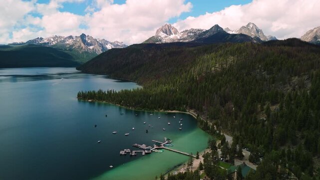 Wide shot of redfish lake and the marina with the sawtooths in the back