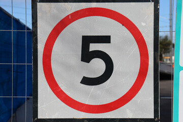 speed limit sign of 5 kmh at construction zone