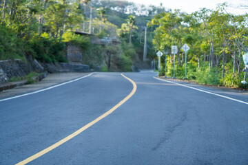 Empty Uphill Road with a Yellow Line