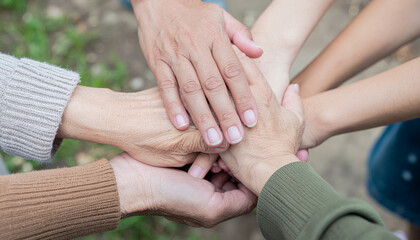 Hands stack in teamwork unity. supportive family group showing connection and togetherness