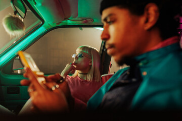 Cool stylish couple in car.